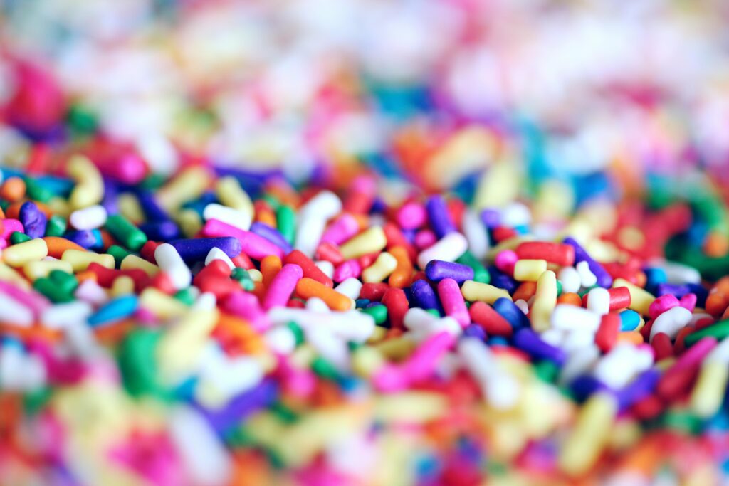 pexels-photo-1174114-1174114 Close-up of vibrant multicolor candy sprinkles creating a playful and sugary abstract background.